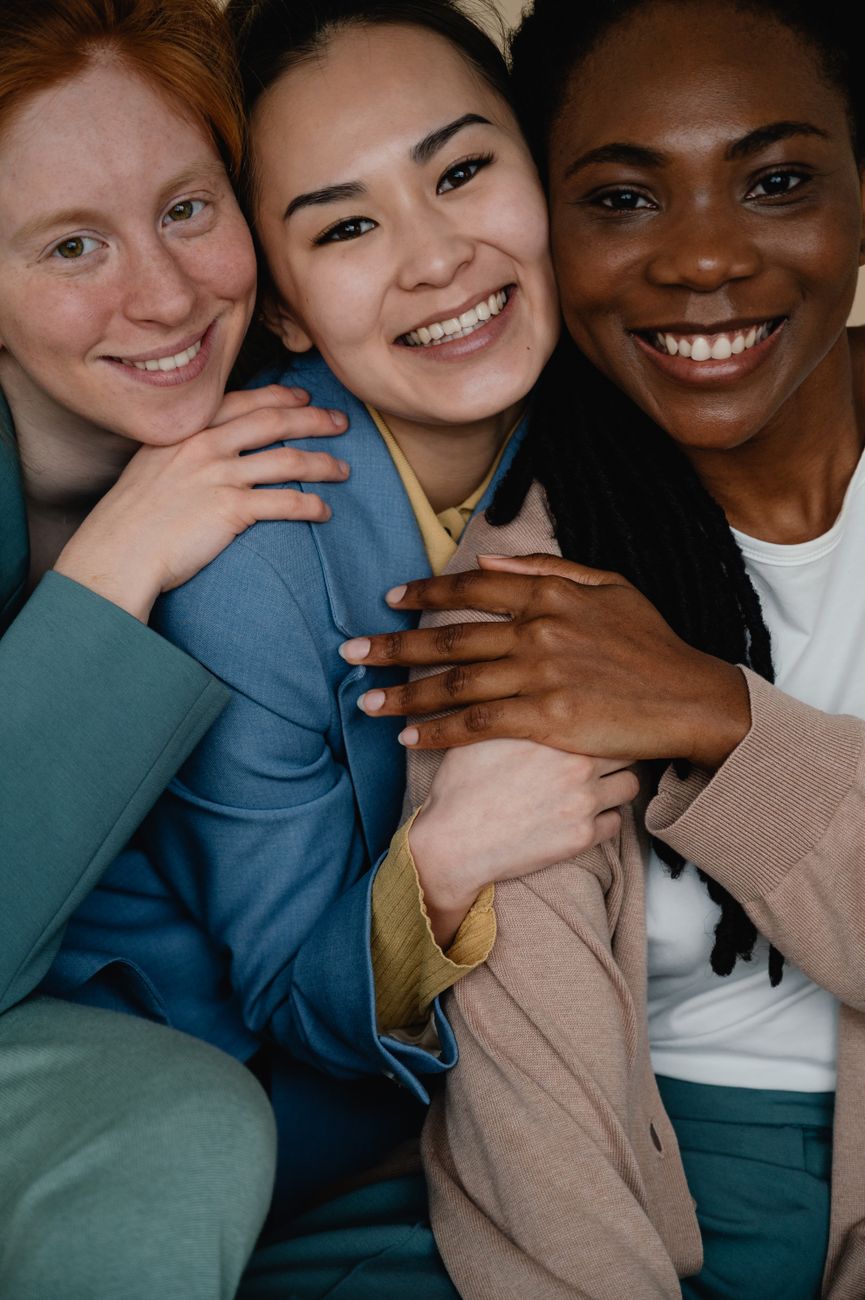 happy women sitting close together